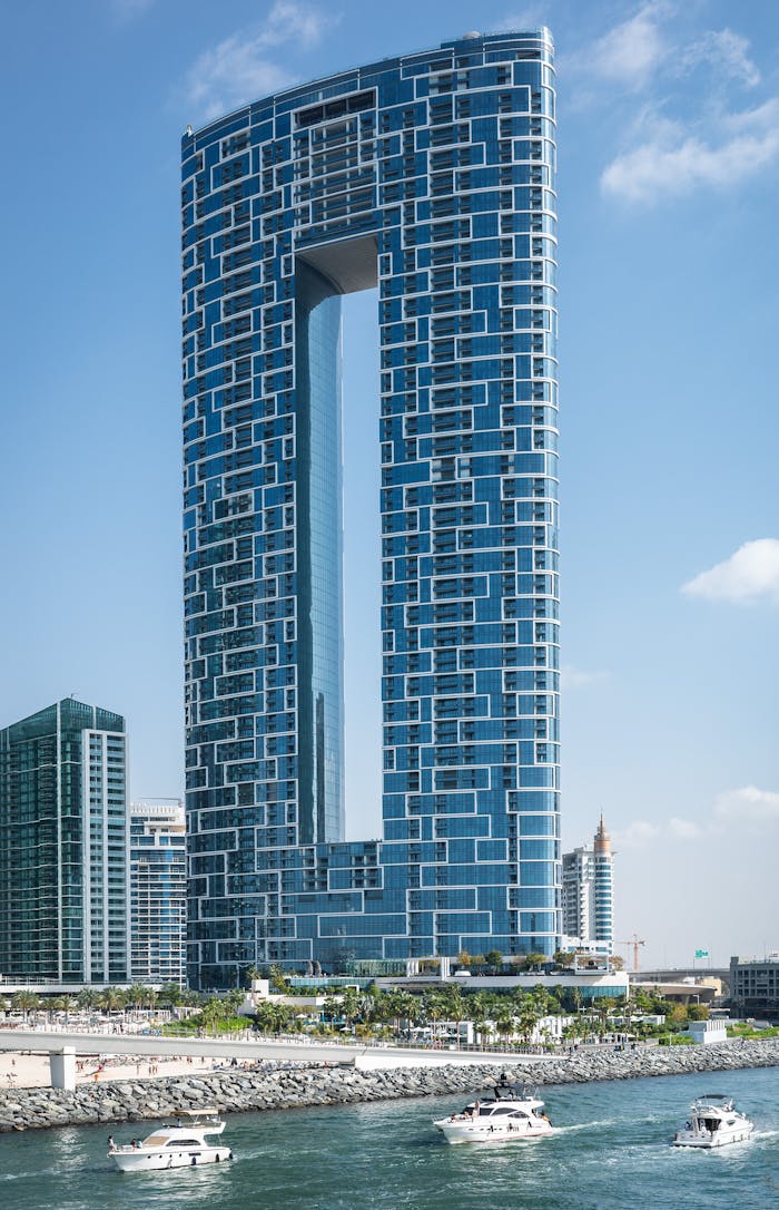 Futuristic glass skyscraper on the shoreline